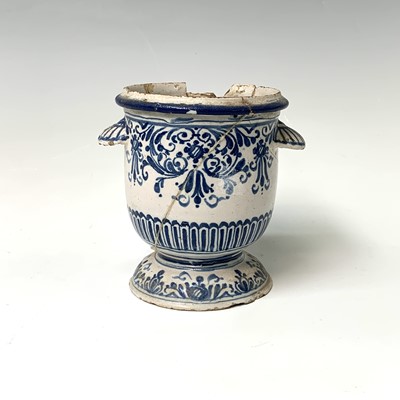 Lot 509 - A tin glazed earthenware urn, probably French,...