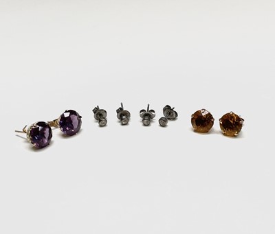 Lot 264 - A pair of 9ct gold and amethyst stud earrings...