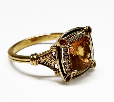 Lot 268 - An 18ct gold ring with a central cushion cut...