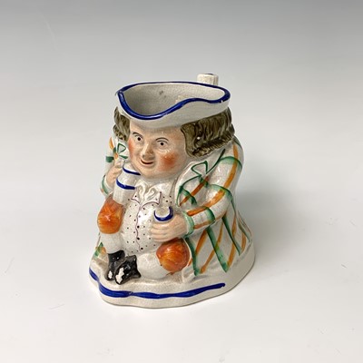 Lot 519 - A Victorian Staffordshire toby jug, height...