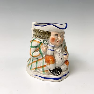 Lot 519 - A Victorian Staffordshire toby jug, height...