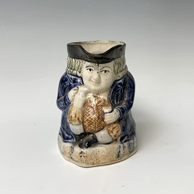 Lot 519 - A Victorian Staffordshire toby jug, height...
