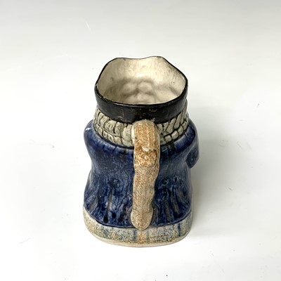 Lot 519 - A Victorian Staffordshire toby jug, height...