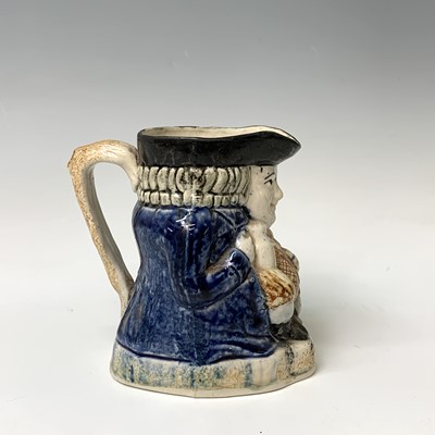 Lot 519 - A Victorian Staffordshire toby jug, height...