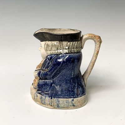 Lot 519 - A Victorian Staffordshire toby jug, height...
