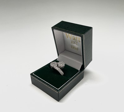 Lot 105 - An 18ct white gold and diamond flowerhead...