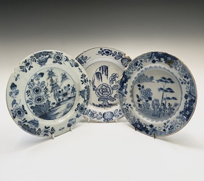 Lot 522 - Three Delft plates, 18th century, largest...