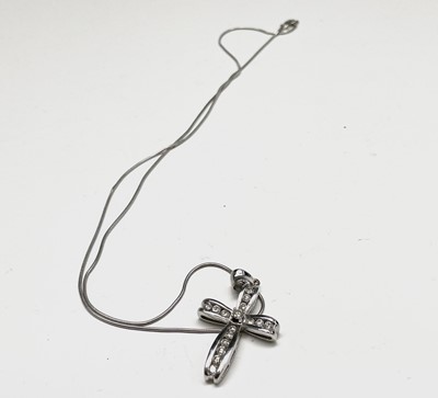 Lot 218 - An 18ct white gold cross pendant set with...