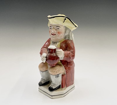 Lot 547 - A Staffordshire Toby jug, 19th century, the...