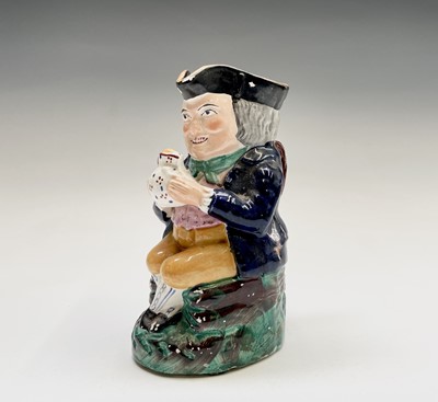 Lot 548 - A Staffordshire Toby jug, 19th century, height...