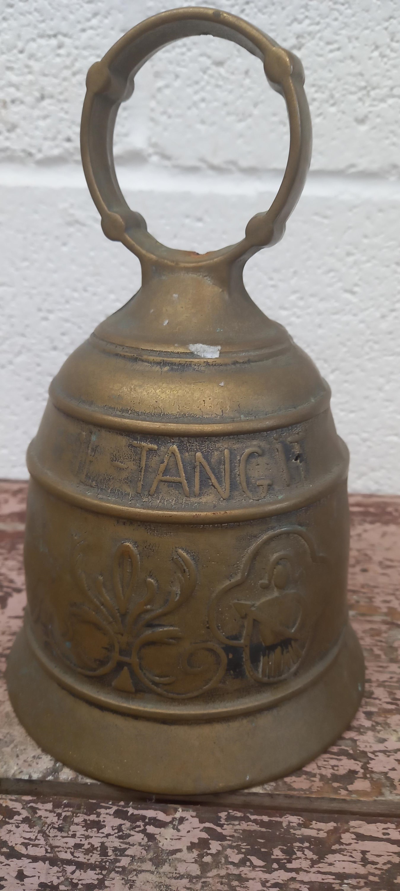 Lot 97 A brass bell with a Latin inscription. The