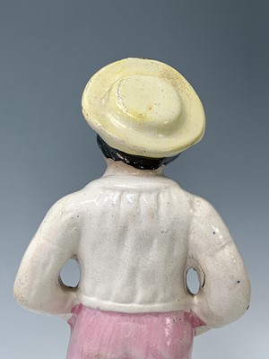 Lot 552 - A Victorian Staffordshire figure of a sailor,...