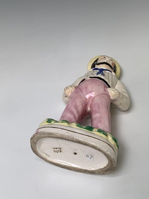 Lot 552 - A Victorian Staffordshire figure of a sailor,...