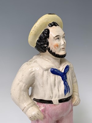 Lot 552 - A Victorian Staffordshire figure of a sailor,...