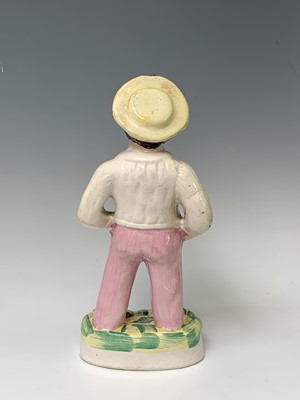 Lot 552 - A Victorian Staffordshire figure of a sailor,...