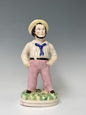 Lot 552 - A Victorian Staffordshire figure of a sailor,...