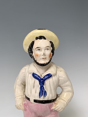 Lot 552 - A Victorian Staffordshire figure of a sailor,...