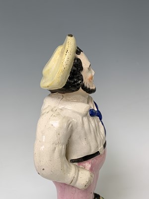 Lot 552 - A Victorian Staffordshire figure of a sailor,...