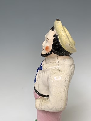 Lot 552 - A Victorian Staffordshire figure of a sailor,...