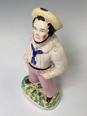 Lot 552 - A Victorian Staffordshire figure of a sailor,...
