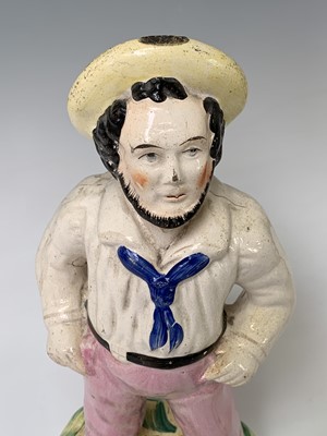 Lot 552 - A Victorian Staffordshire figure of a sailor,...