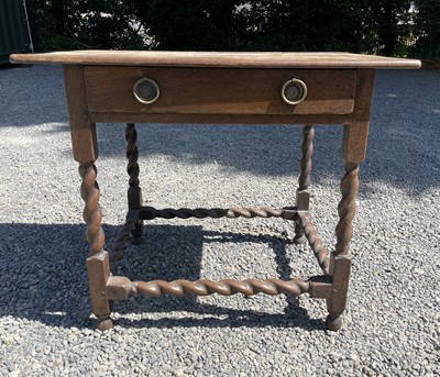 Lot 554 - An 18th century oak side table, with a single...