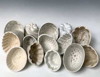 Lot 558 - A selection of fifteen white ceramic jelly...