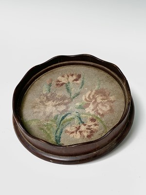 Lot 562 - A 19th century circular walnut bottle coaster,...