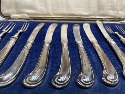 Lot 65 - A set of six dessert knives and forks with the...
