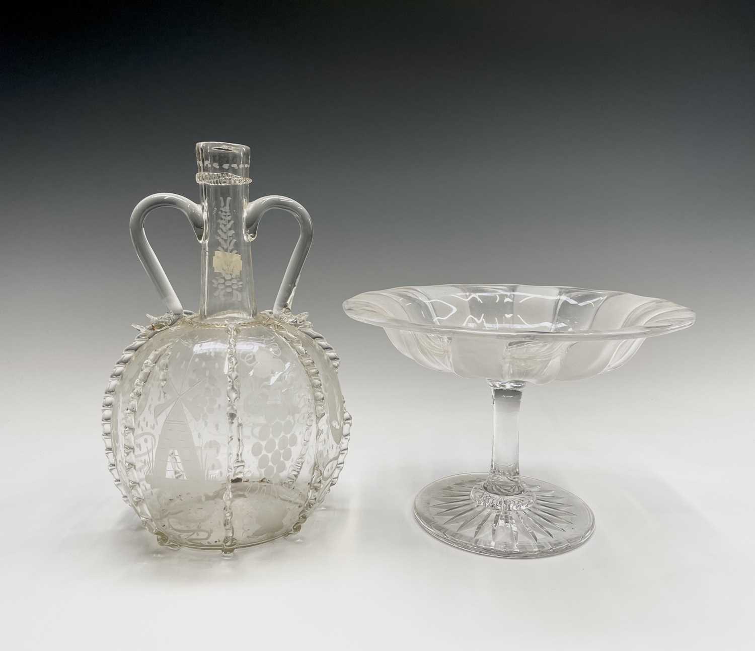 Lot 801 - A 17th century style Dutch glass twin handled...