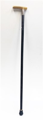 Lot 566 - An early 20th century walking cane with horn...