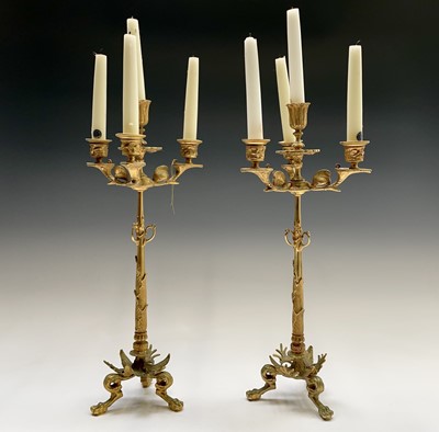 Lot 25 - A pair of gilt metal ornate candelabra,...