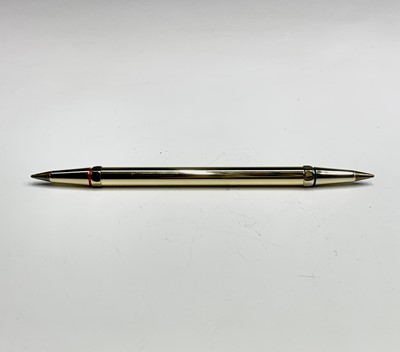 Lot 150 - A Cartier gold plated pen, one end with a red...