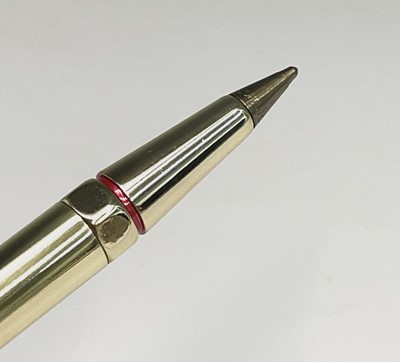 Lot 150 - A Cartier gold plated pen, one end with a red...