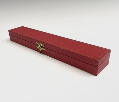 Lot 150 - A Cartier gold plated pen, one end with a red...