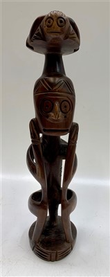 Lot 44 - A carved wood figure of a man, possibly...
