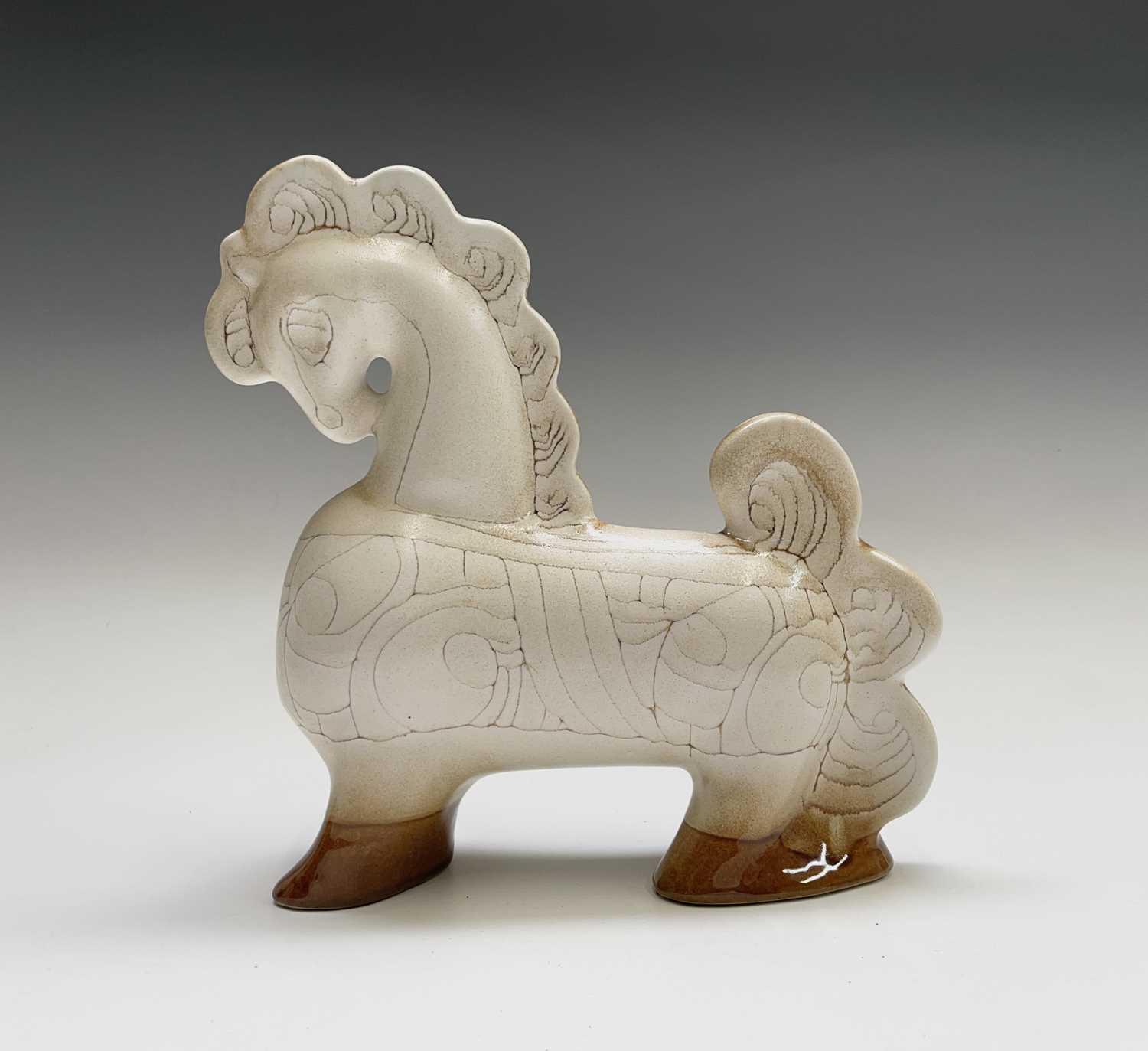 Lot 1305 - A cream Newlyn Pottery horse in Medallion...