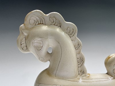 Lot 1305 - A cream Newlyn Pottery horse in Medallion...