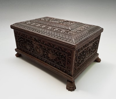 Lot 1012 - An Indian carved sandalwood box, 19th century,...