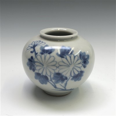 Lot 730 - A Japanese blue and white vase, of squat form...