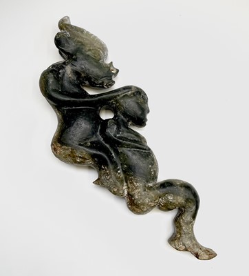 Lot 418 - A Chinese nephrite jade carving of a demon and...