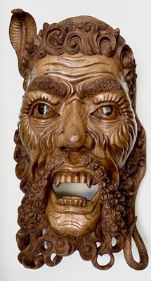 Lot 417 - A large South East Asian carved hardwood mask,...