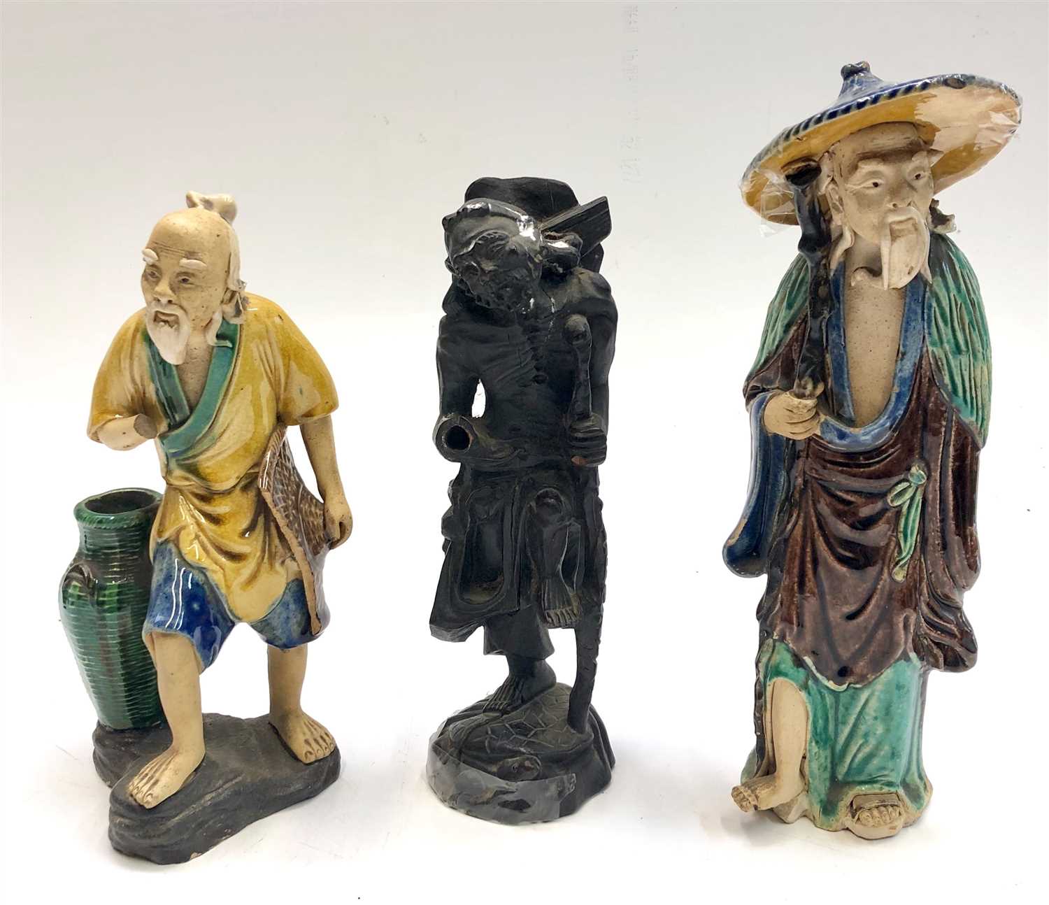 Lot 740 - Two Chinese pottery figures and a carved wood...