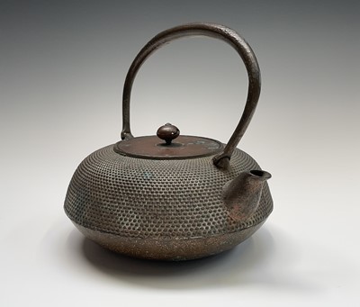 Lot 16 - A Japanese iron teapot, 19th century,...
