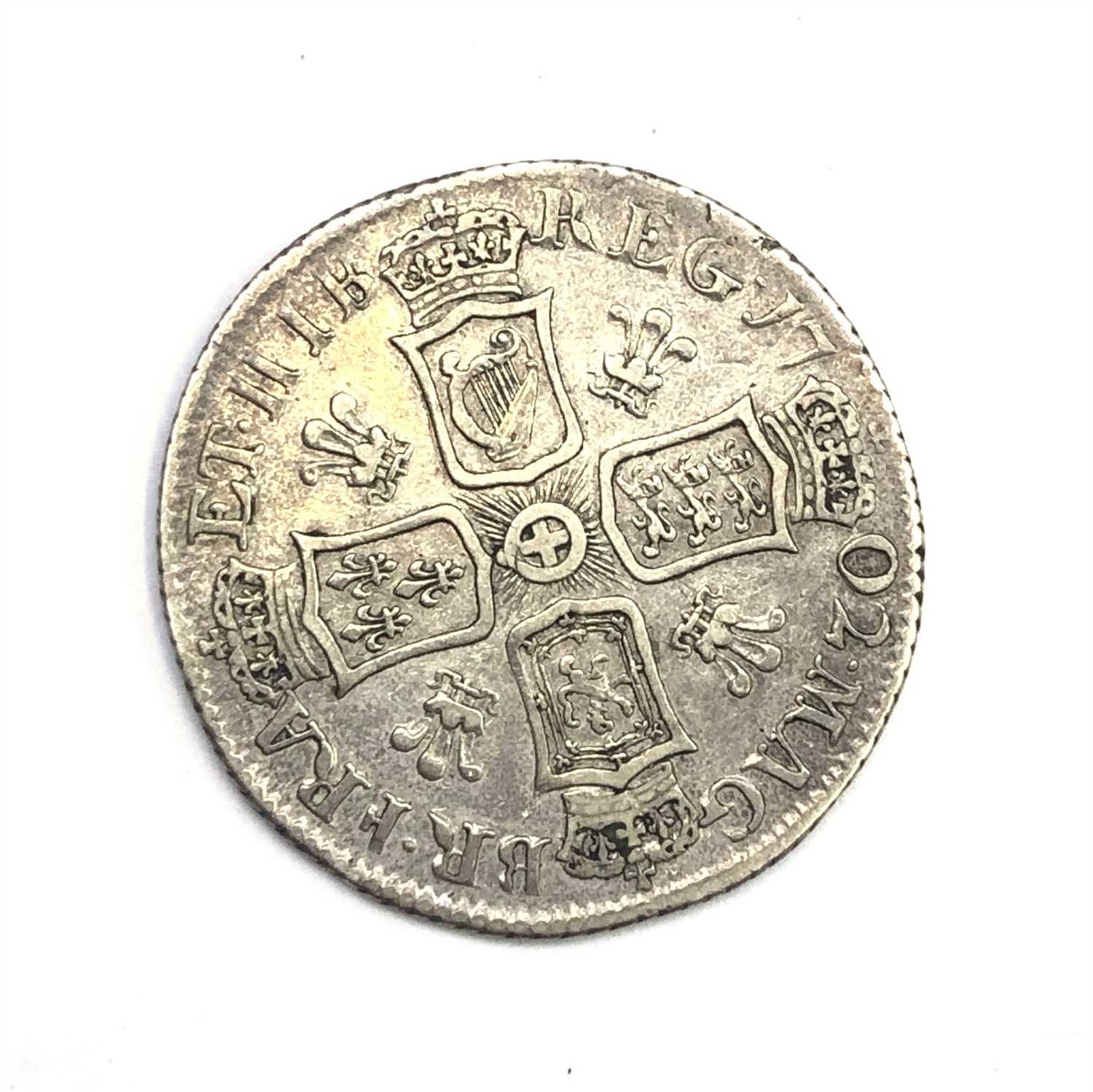 Lot 2663 - A Queen Anne shilling, 1702, with plumes,...