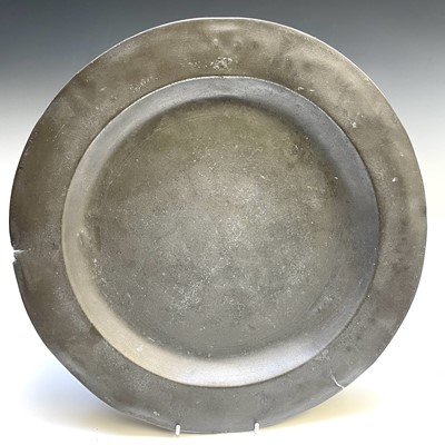 Lot 179 - An 18th century pewter charger, London touch...