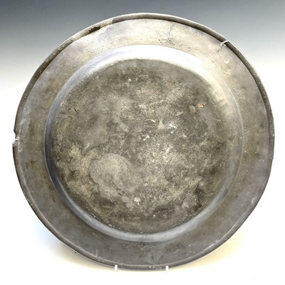 Lot 179 - An 18th century pewter charger, London touch...