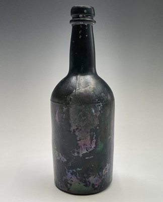 Lot 824 - A 19th century green glass bottle. Height 21cm