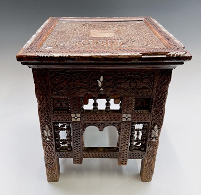 Lot 1007 - A Syrian carved wood occasional table, 19th...