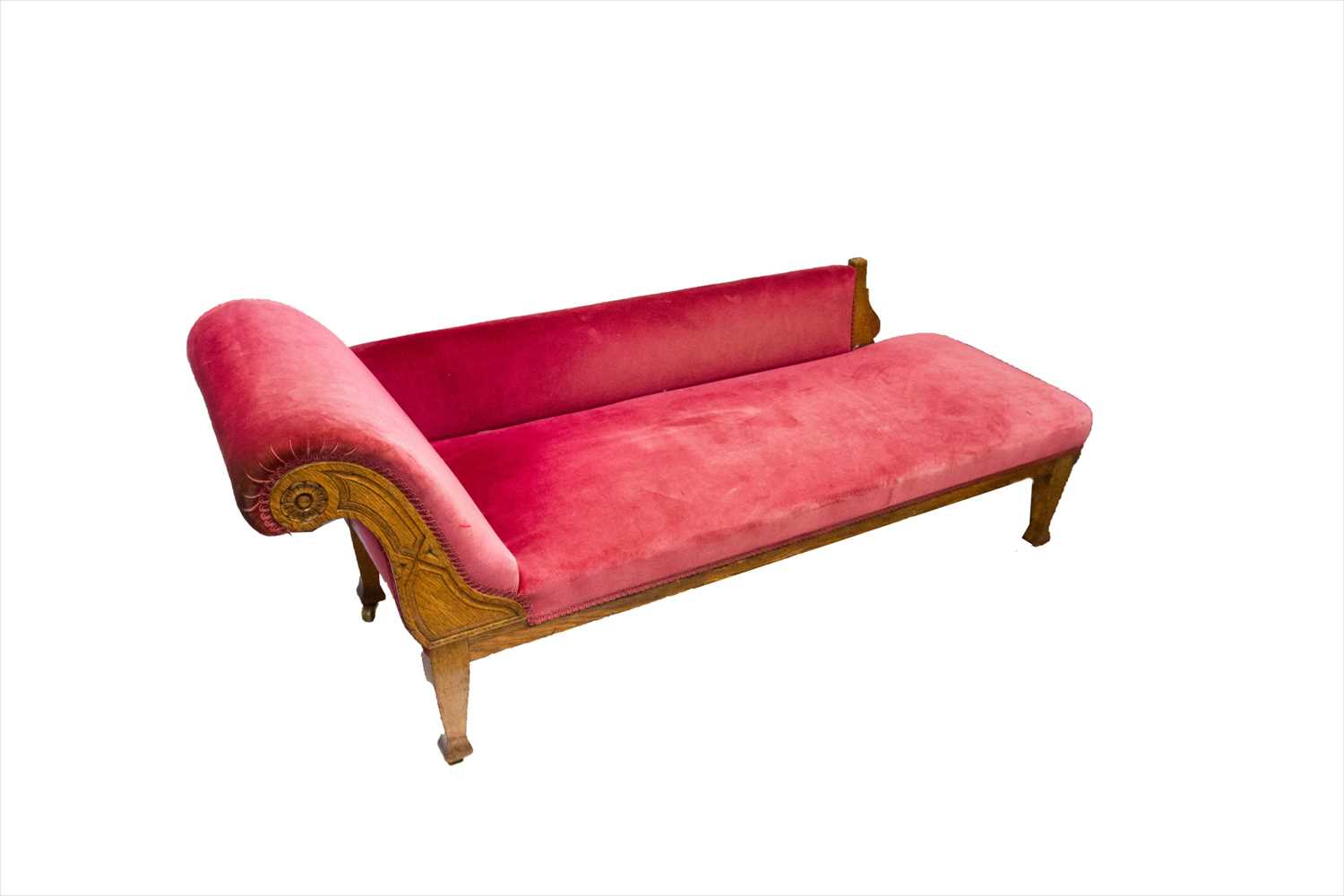 Lot 3279 - A late 19th century oak chaise longue.